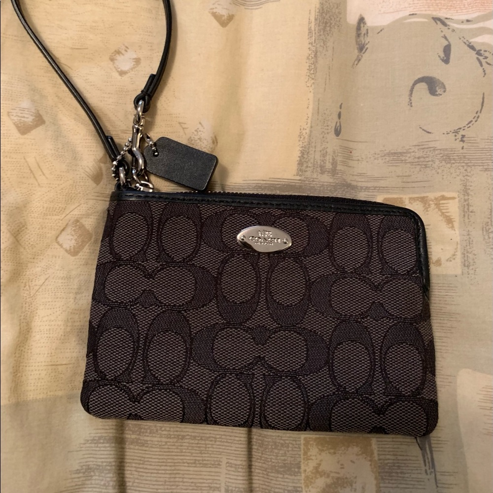 Coach wristlet.  Used a few times. Approx 6 x 4.